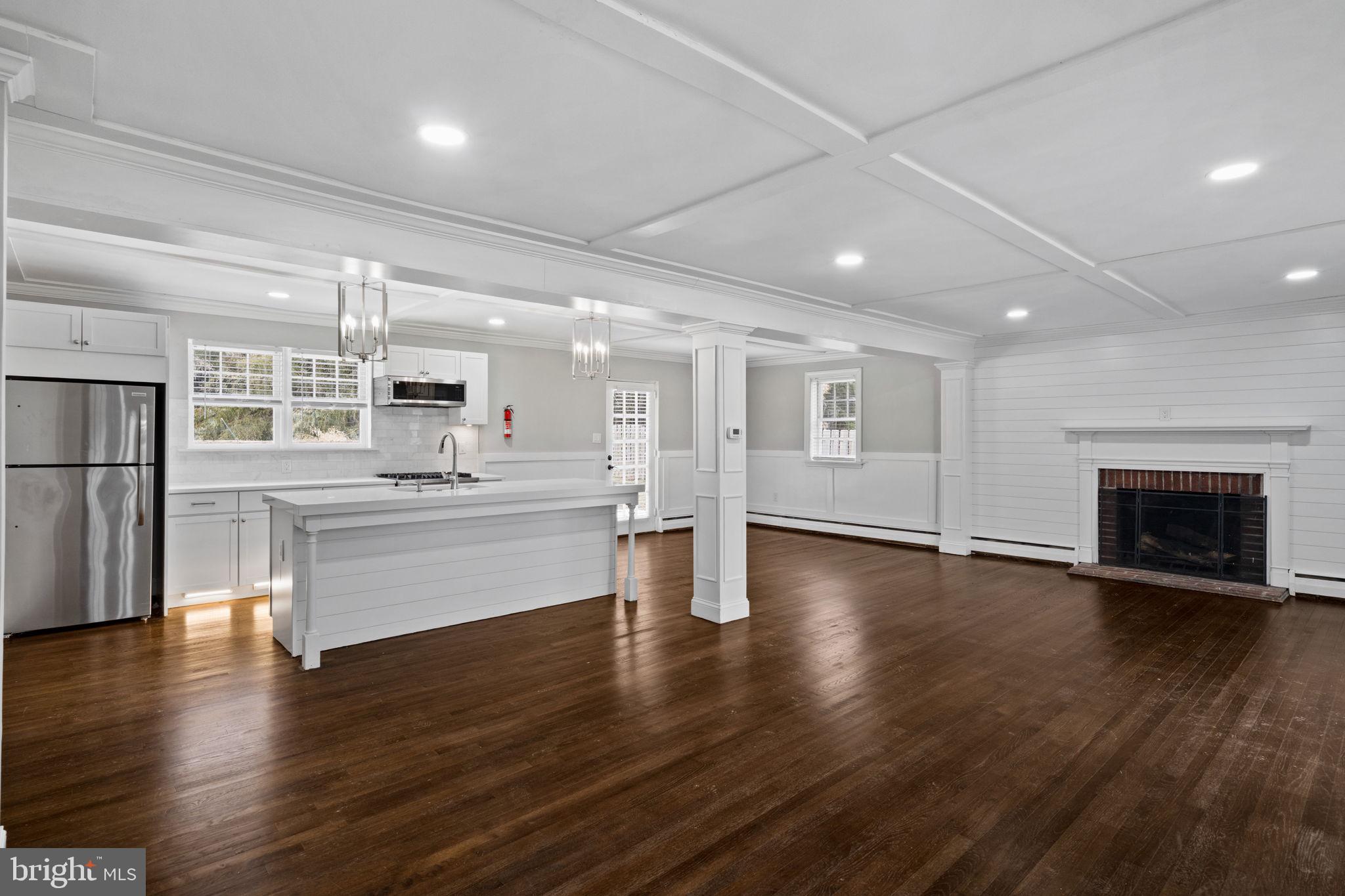 383 Upper Gulph Road Wayne, PA 19087 - Photo 6 of 42 a large white kitchen with stainless steel appliances