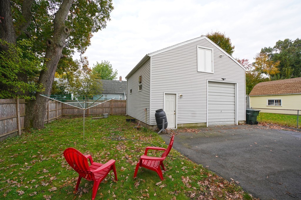 248 Abbott Street Springfield, MA 01118 - Photo 3 of 20 a backyard of a house with table and chairs