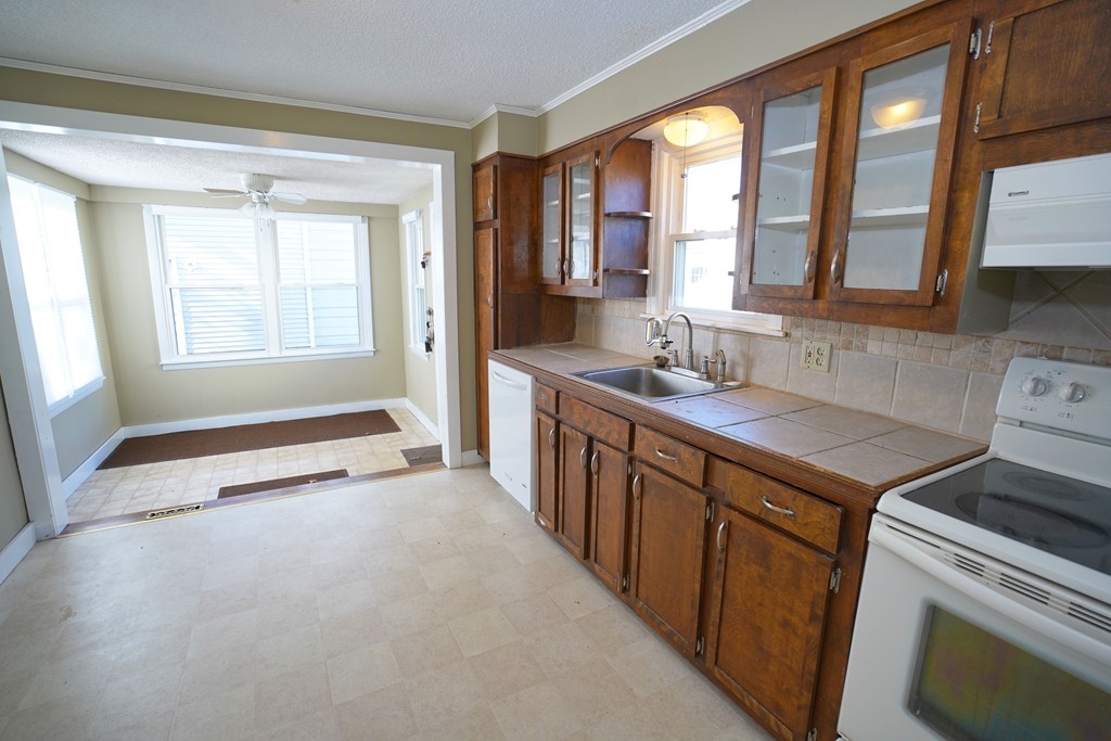 248 Abbott Street Springfield, MA 01118 - Photo 5 of 20 a kitchen that has a sink a stove and a window