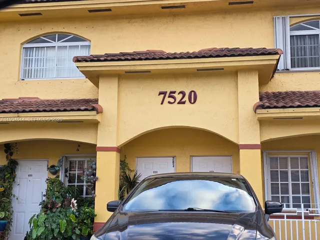 a front view of a house with lake