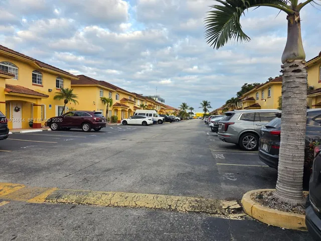 a view of street with parked cars
