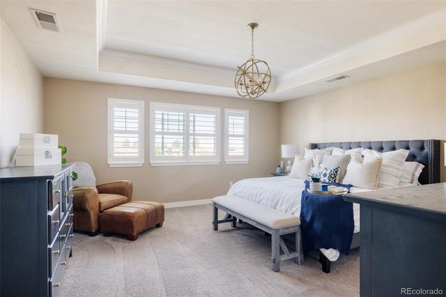 a bedroom with bed and window