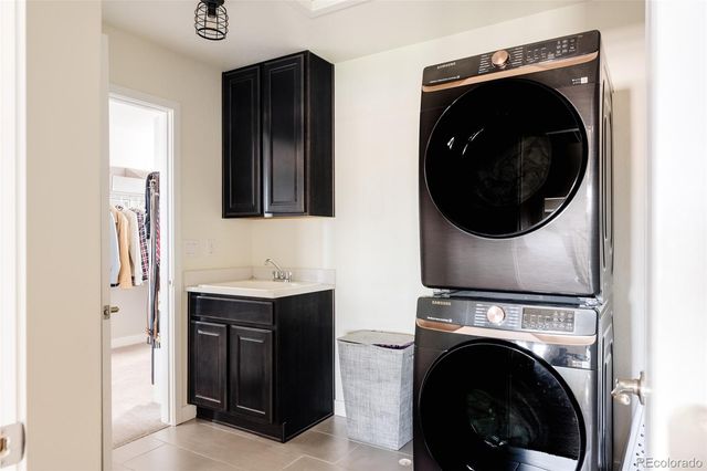 a view of a hallway with washer and dryer