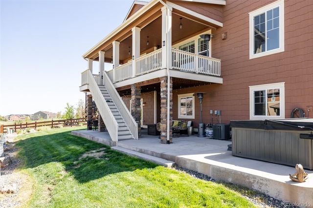 a front view of a house with a yard outdoor seating and barbeque oven
