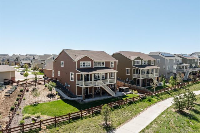 an aerial view of a house with yard swimming pool and outdoor seating