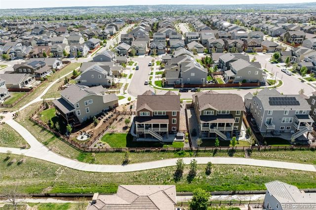 an aerial view of a house with a garden