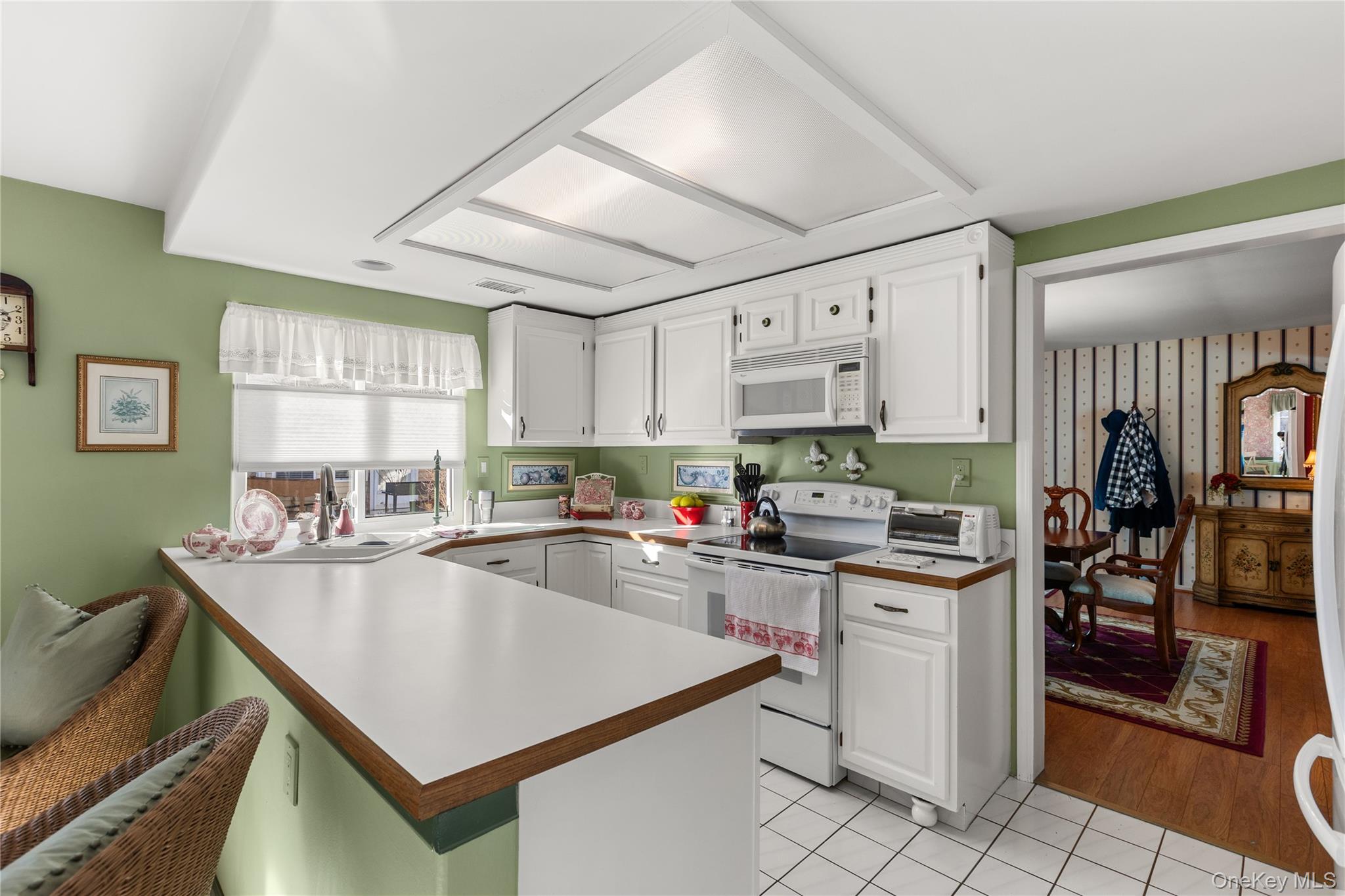 77 Glen Drive Ridge, NY 11961 - Photo 11 of 27 a kitchen with cabinets a sink appliances and cabinets