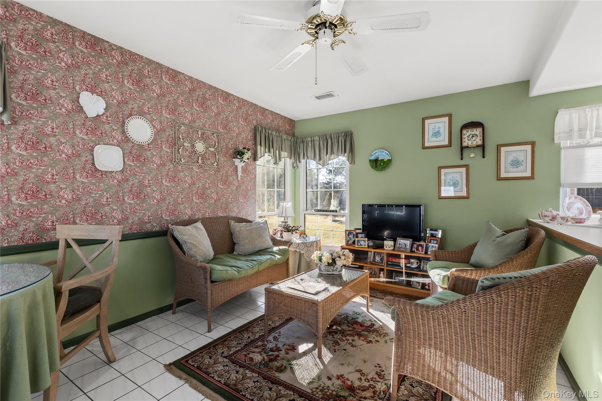 77 Glen Drive Ridge, NY 11961 - Photo 15 of 27 a living room with furniture and a fireplace