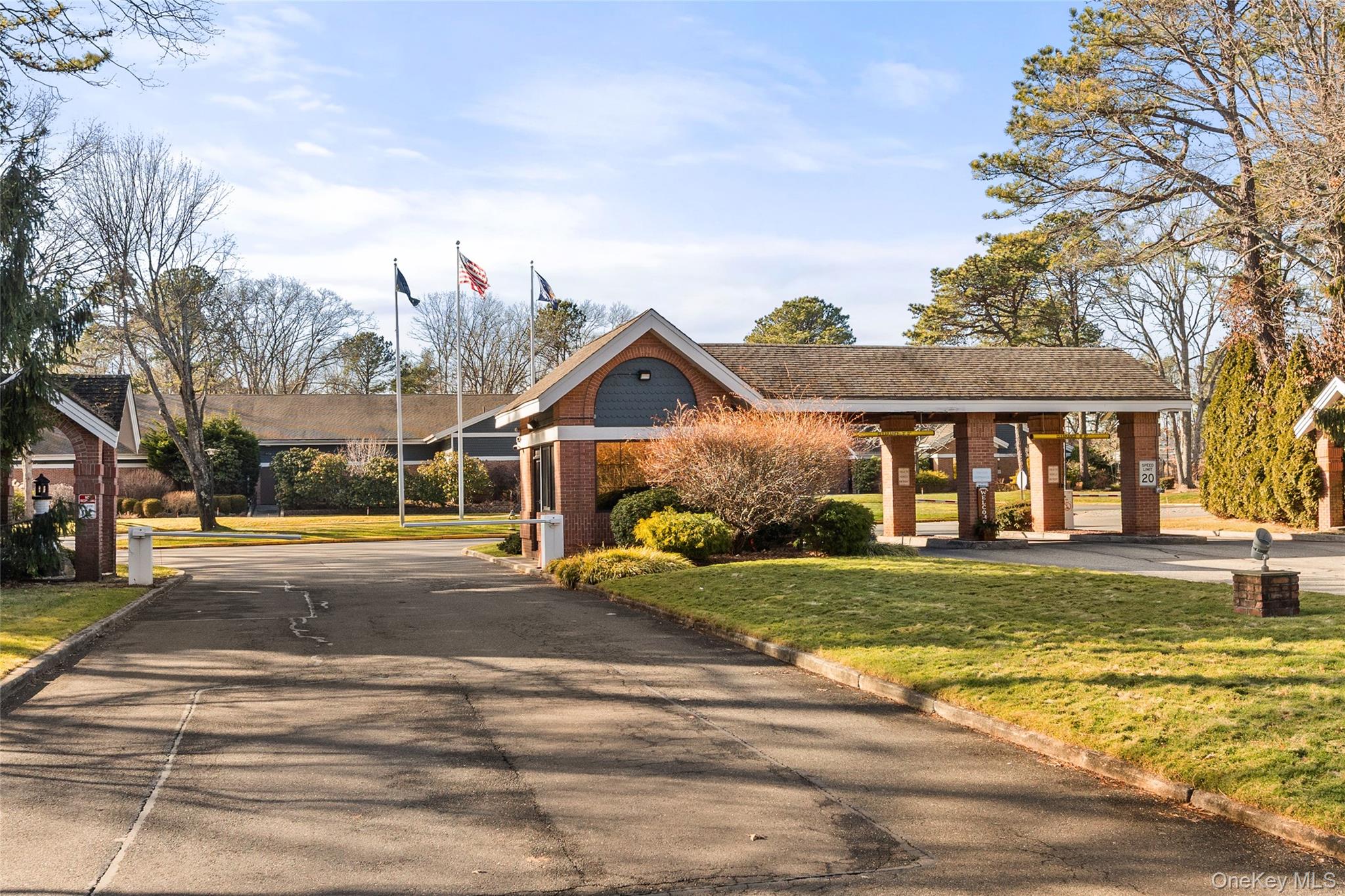 77 Glen Drive Ridge, NY 11961 - Photo 2 of 27 a view of a big house with a big yard and large trees