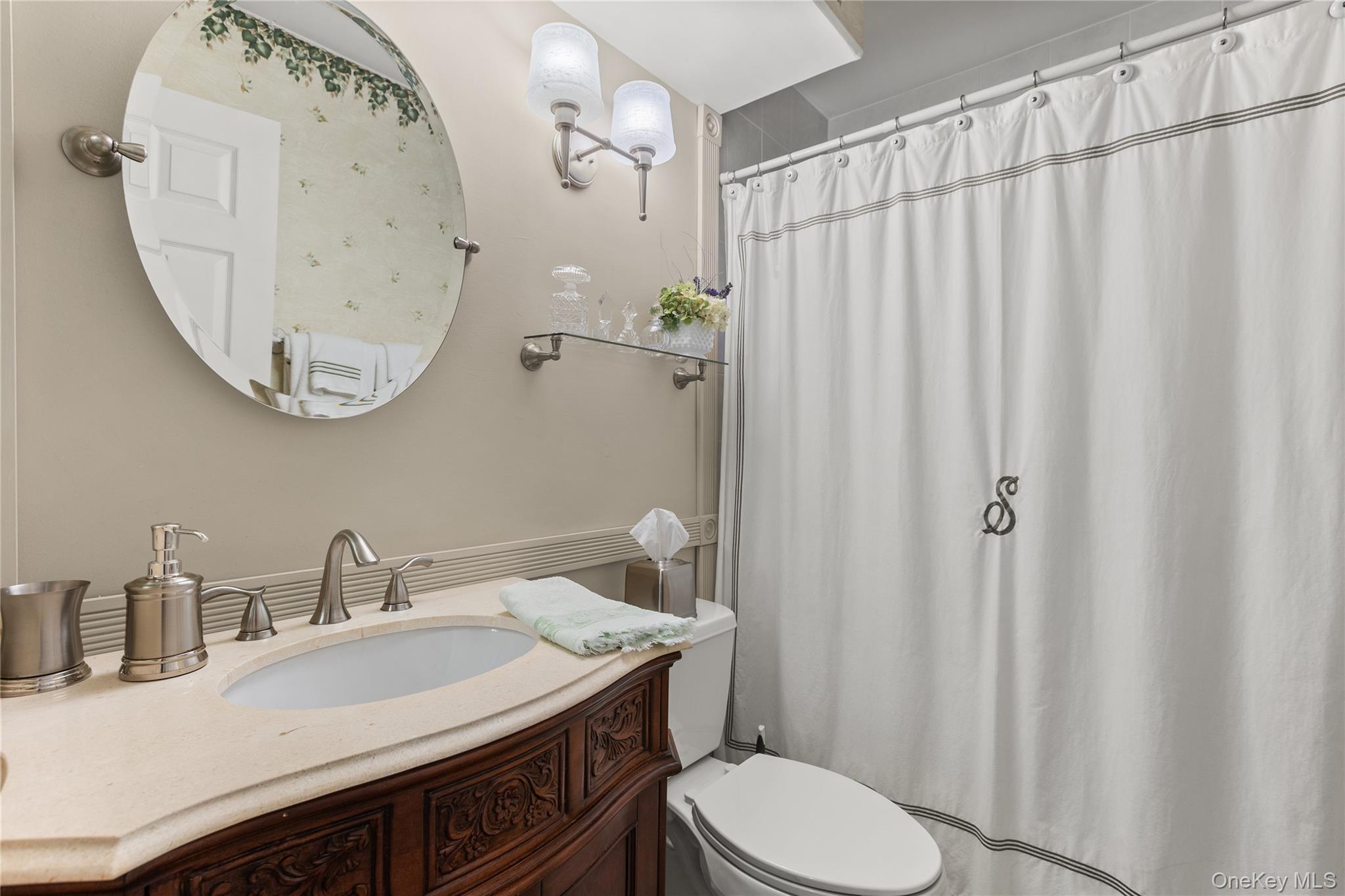 77 Glen Drive Ridge, NY 11961 - Photo 21 of 27 a bathroom with a sink a toilet and a mirror