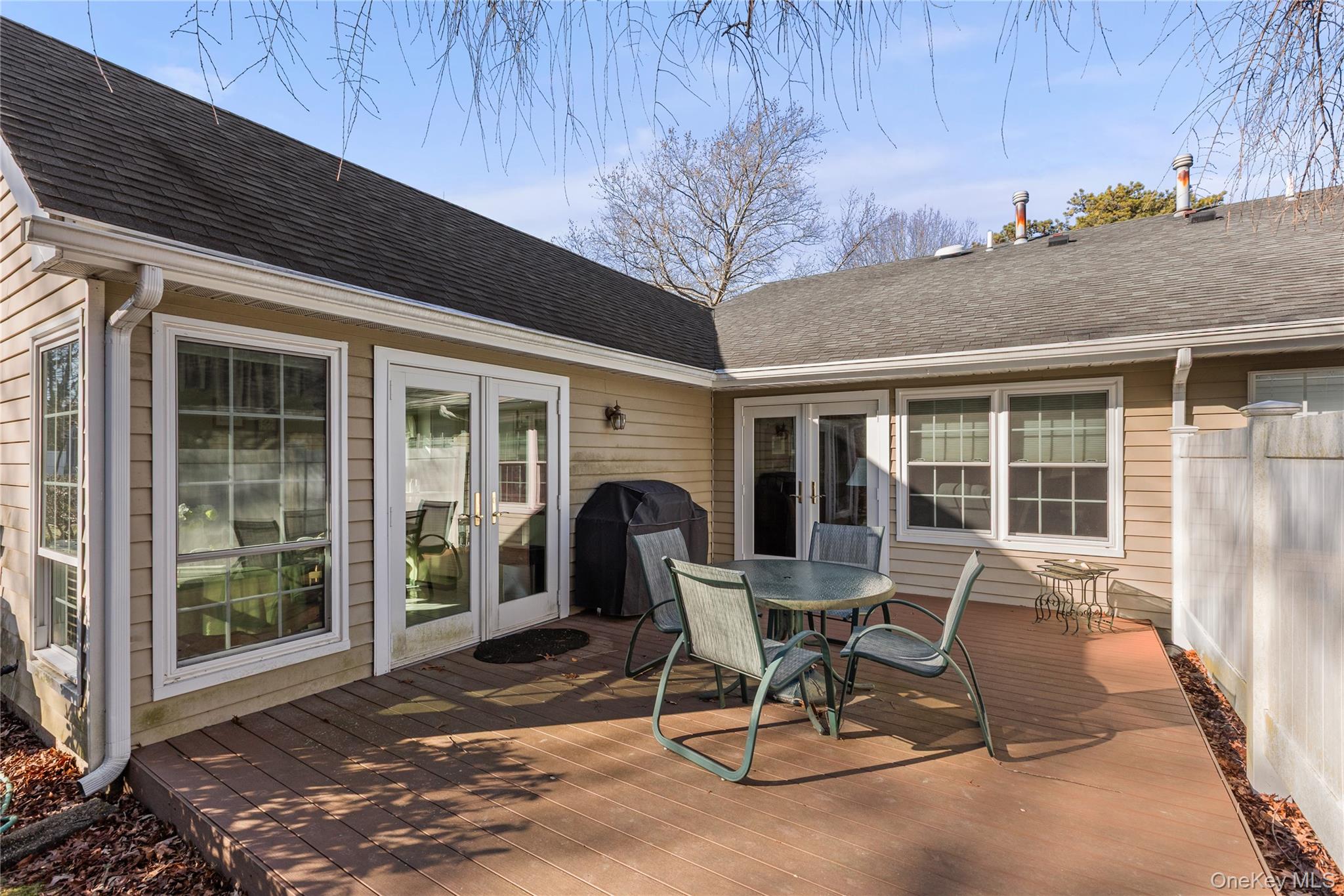 77 Glen Drive Ridge, NY 11961 - Photo 24 of 27 a patio with table and chairs