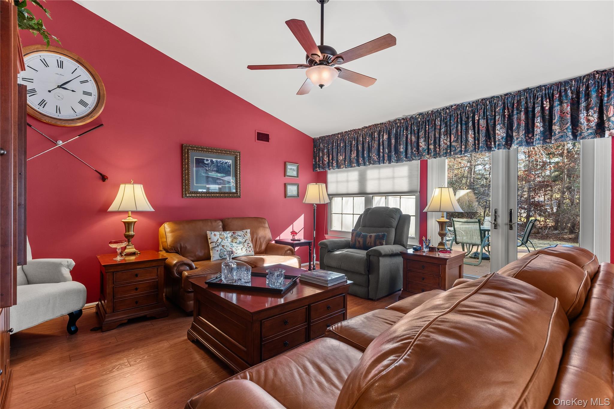 77 Glen Drive Ridge, NY 11961 - Photo 8 of 27 a living room with furniture a fireplace and a large window