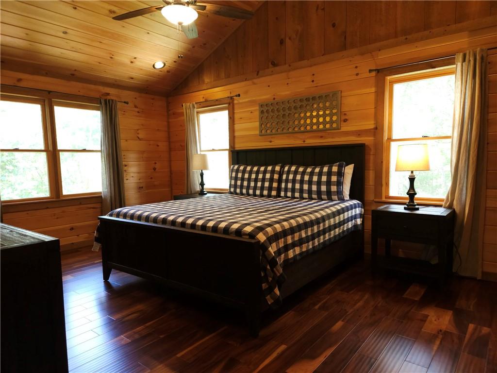 101 Hothouse Drive Mineral Bluff, GA 30559 - Photo 29 of 63 a bed sitting in a spacious bedroom next to a window