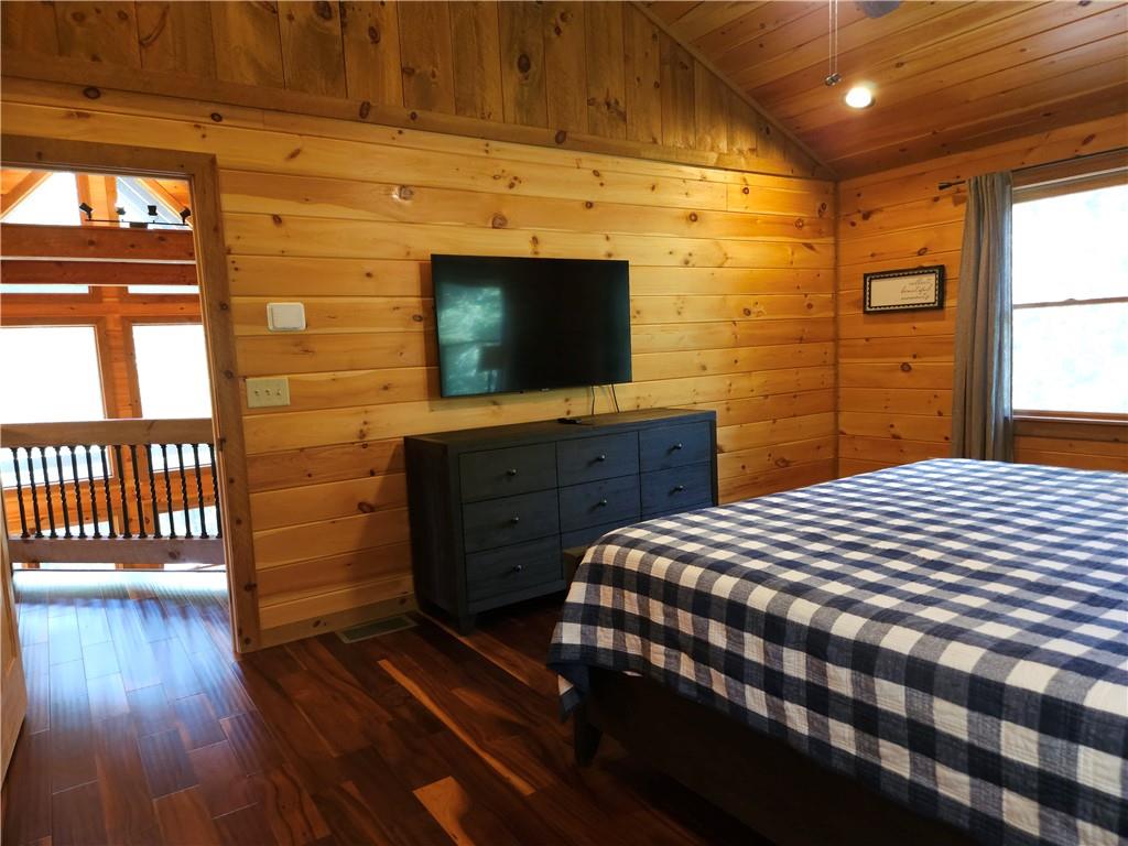 101 Hothouse Drive Mineral Bluff, GA 30559 - Photo 30 of 63 a bedroom with a bed and a flat screen tv