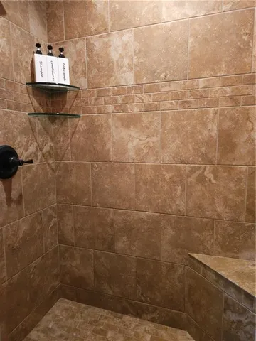 a room with wooden floor and windows