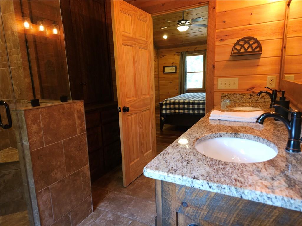 101 Hothouse Drive Mineral Bluff, GA 30559 - Photo 35 of 63 a bathroom with a sink and a mirror