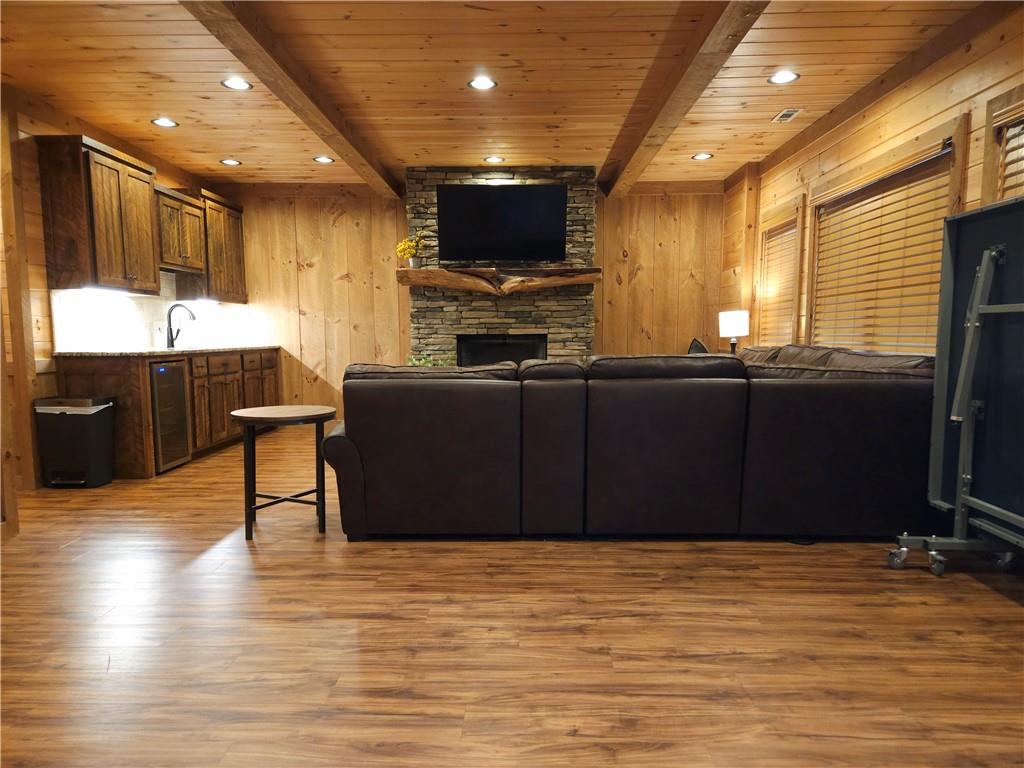 101 Hothouse Drive Mineral Bluff, GA 30559 - Photo 38 of 63 a view of a living room with kitchen furniture and a flat screen tv