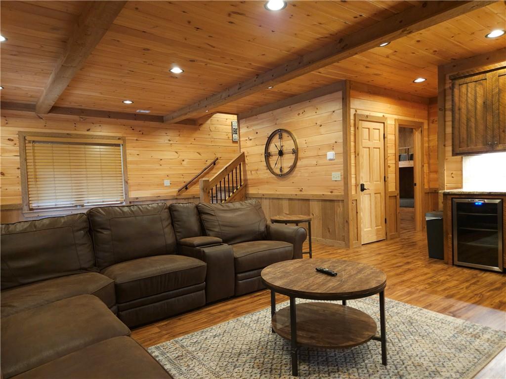 101 Hothouse Drive Mineral Bluff, GA 30559 - Photo 40 of 63 a living room with furniture a clock on wall and a table