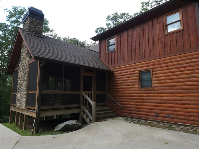 a outdoor living space with furniture and a fireplace