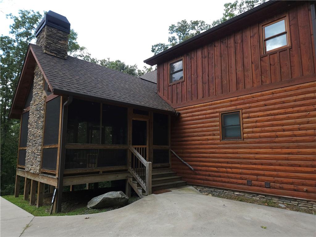 101 Hothouse Drive Mineral Bluff, GA 30559 - Photo 4 of 63 a front view of a house with a window