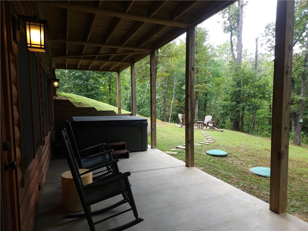 101 Hothouse Drive Mineral Bluff, GA 30559 - Photo 49 of 63 a view of a patio with table and chairs