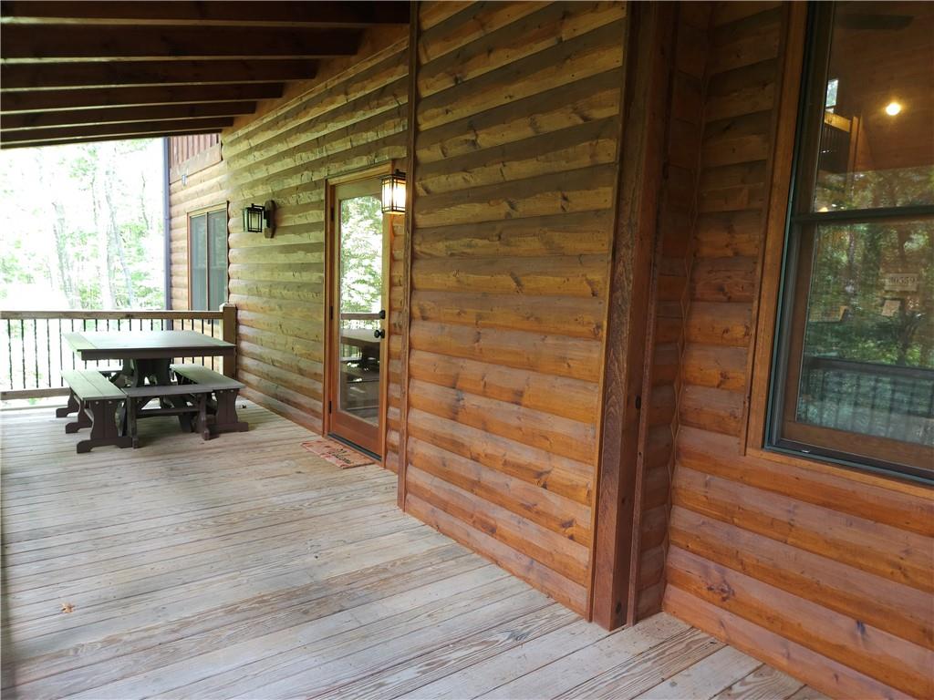 101 Hothouse Drive Mineral Bluff, GA 30559 - Photo 55 of 63 a view of a balcony with chairs and wooden floor