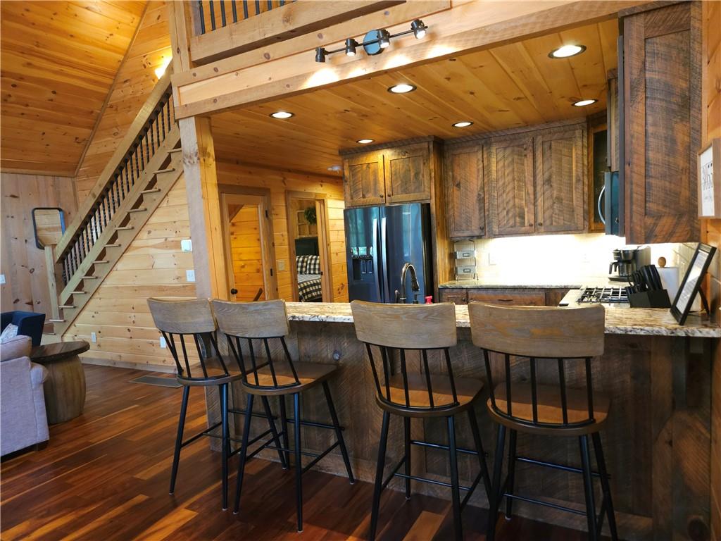 101 Hothouse Drive Mineral Bluff, GA 30559 - Photo 8 of 63 a view of a dining room with furniture and wooden floor