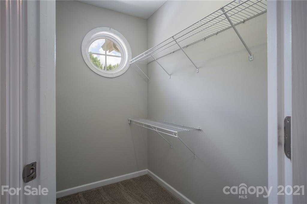 914 Copperstone Lane, Unit 177 Fort Mill, SC 29708 - Photo 21 of 27 a view of small space with racks on the wall