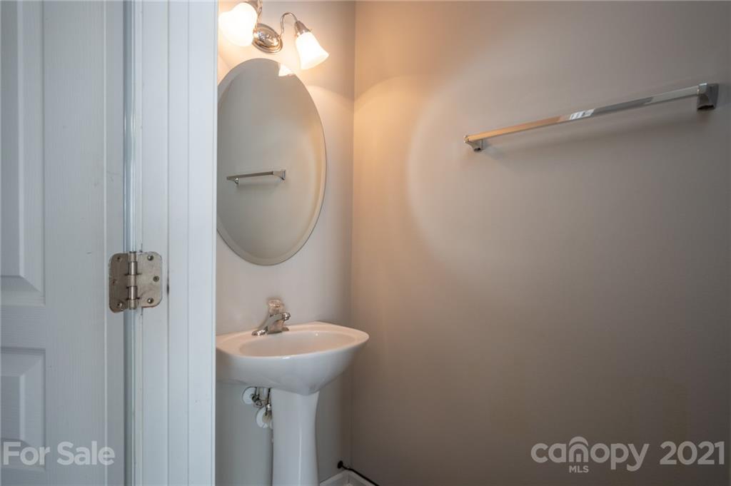 914 Copperstone Lane, Unit 177 Fort Mill, SC 29708 - Photo 9 of 27 a bathroom with a sink and mirror