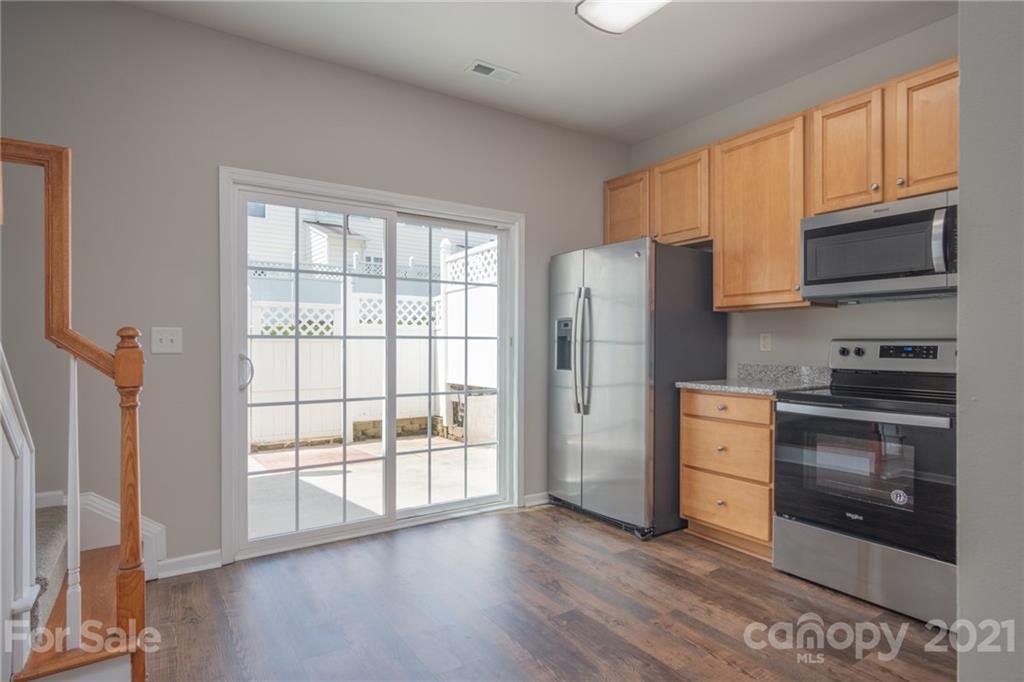 914 Copperstone Lane, Unit 177 Fort Mill, SC 29708 - Photo 10 of 27 a kitchen with stainless steel appliances a stove a refrigerator and a sink