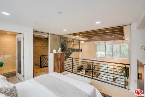 a view of living room with furniture and a window