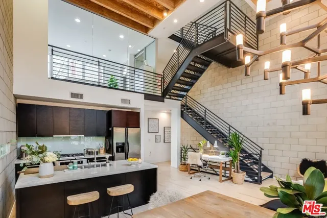 a kitchen with a sink cabinets and appliances