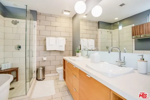 a bathroom with a sink and a shower