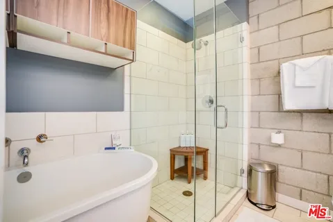 a bathroom with a toilet a sink and a shower
