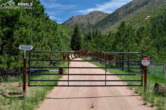 5975 Wellington Road Cascade, CO 80809 - Photo 2 of 32 Fully fenced & gated property - Seller provided photo