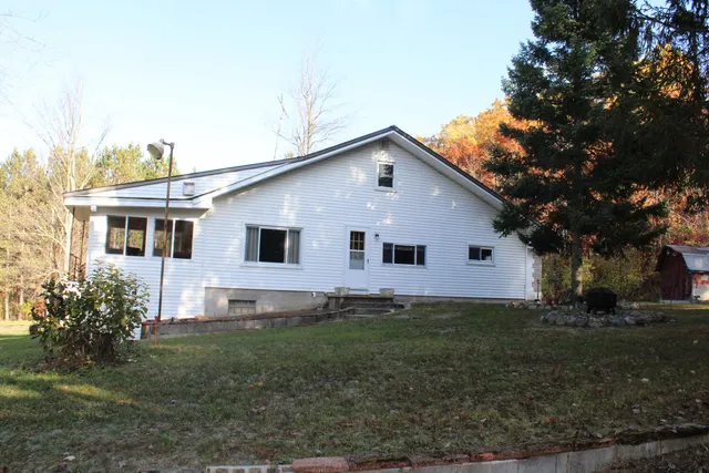 $650,000 | 401 South Bass Lake Avenue, Harrison, MI 48625