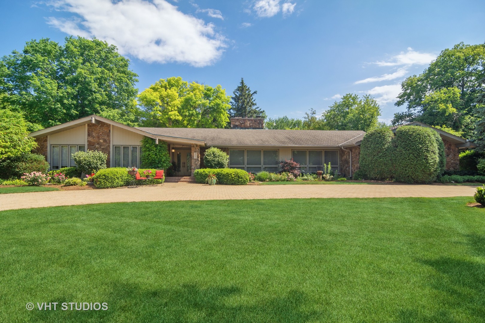 2327 Coach Road Long Grove, IL 60047 - Photo 2 of 58 a front view of a house with a garden