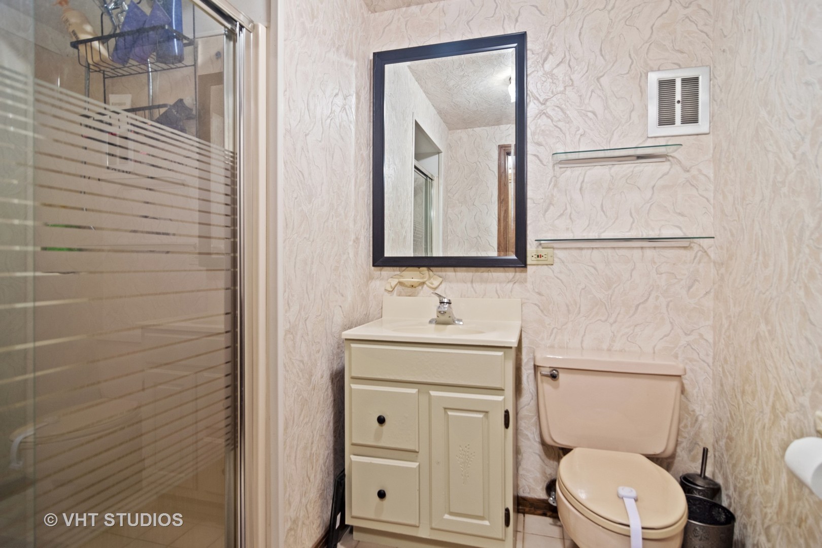 2327 Coach Road Long Grove, IL 60047 - Photo 27 of 58 a bathroom with a toilet a sink a mirror and vanity