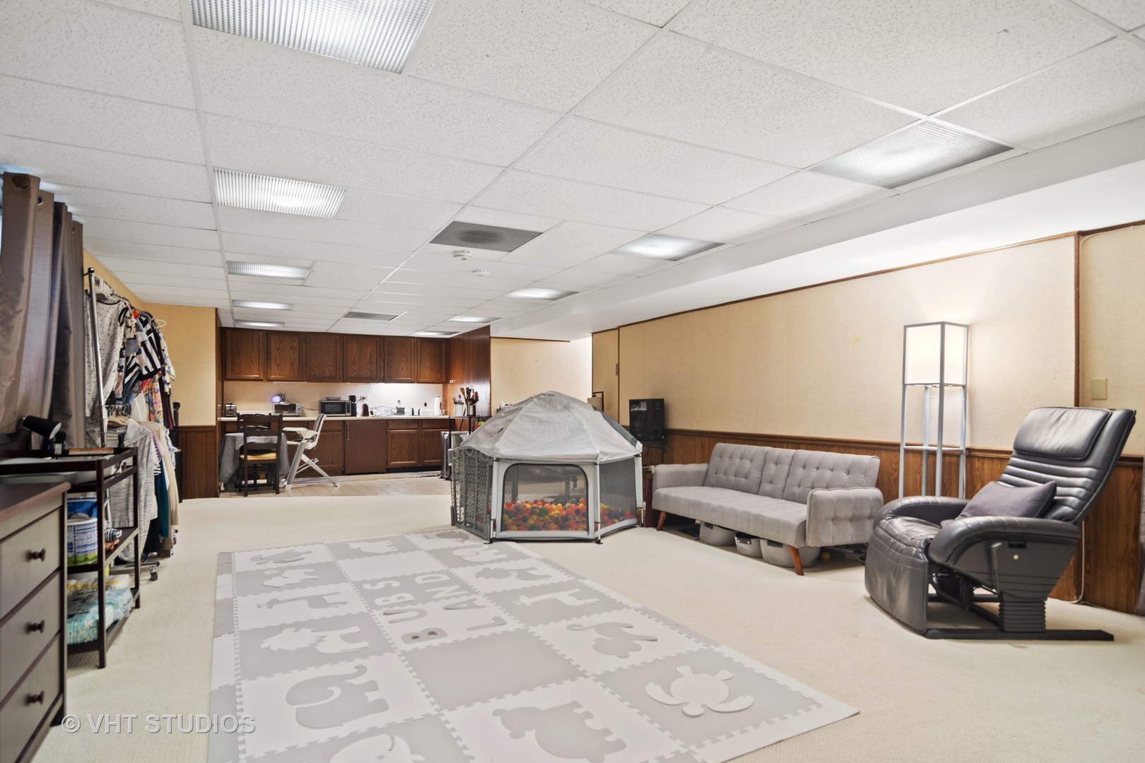 2327 Coach Road Long Grove, IL 60047 - Photo 28 of 58 a living room with furniture a flat screen tv and gym equipment