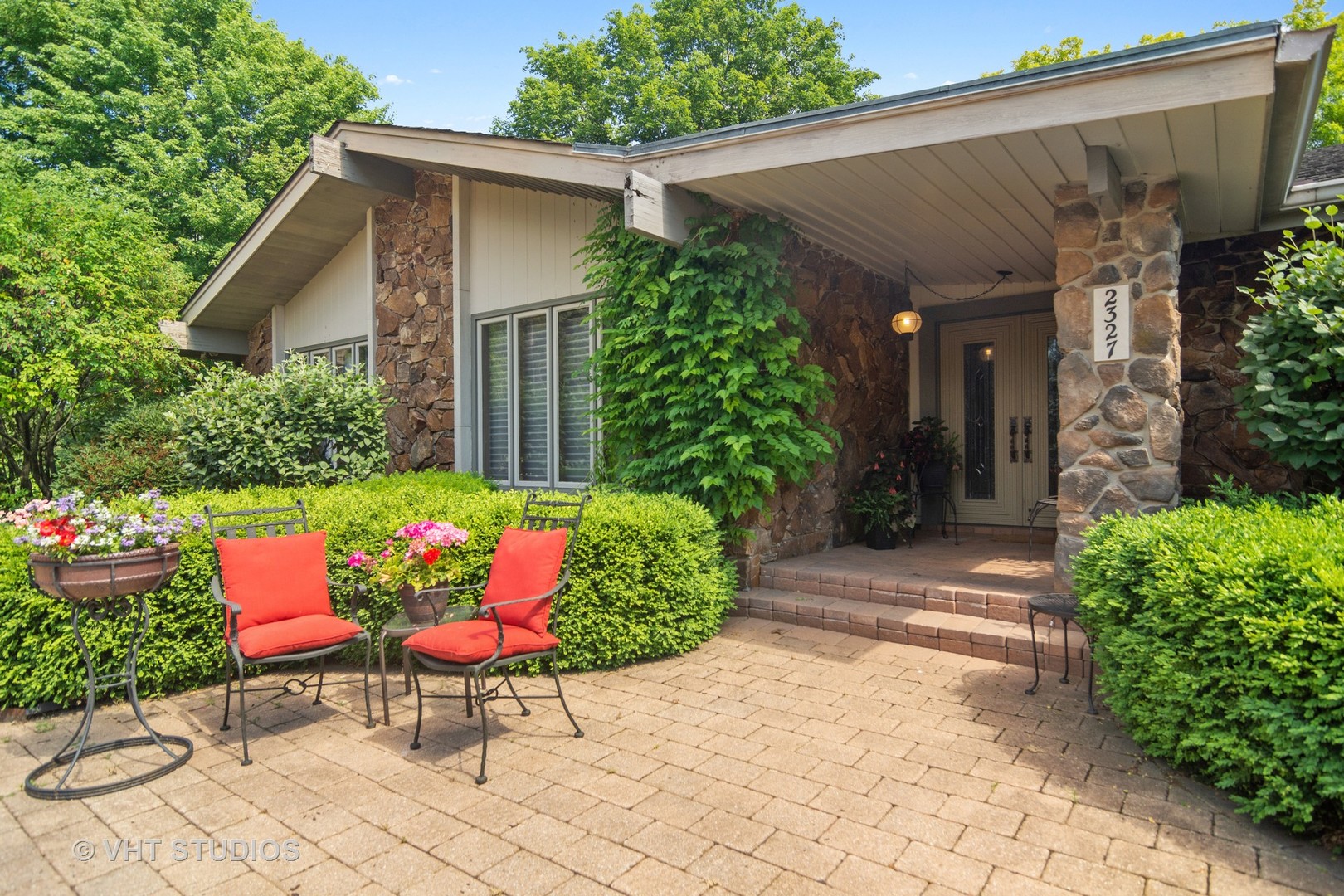 2327 Coach Road Long Grove, IL 60047 - Photo 4 of 58 a view of a chairs and table in a backyard