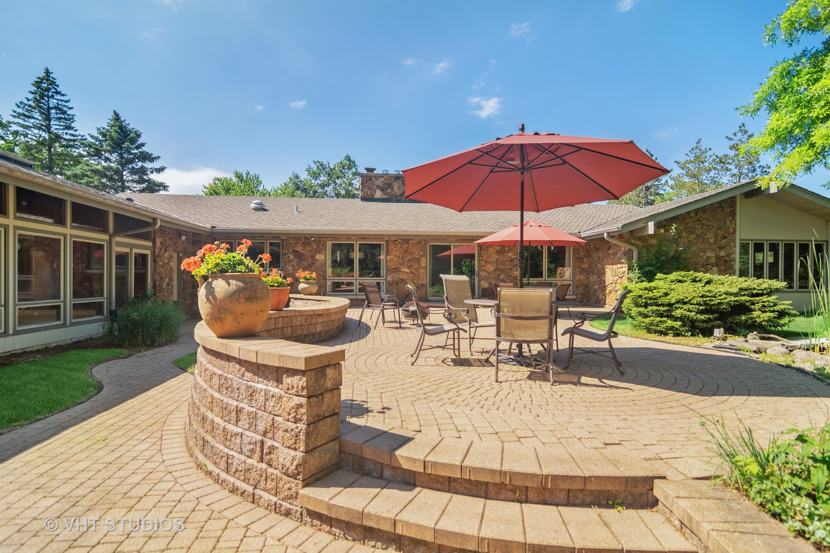 2327 Coach Road Long Grove, IL 60047 - Photo 35 of 58 a view of a patio with table and chairs under an umbrella