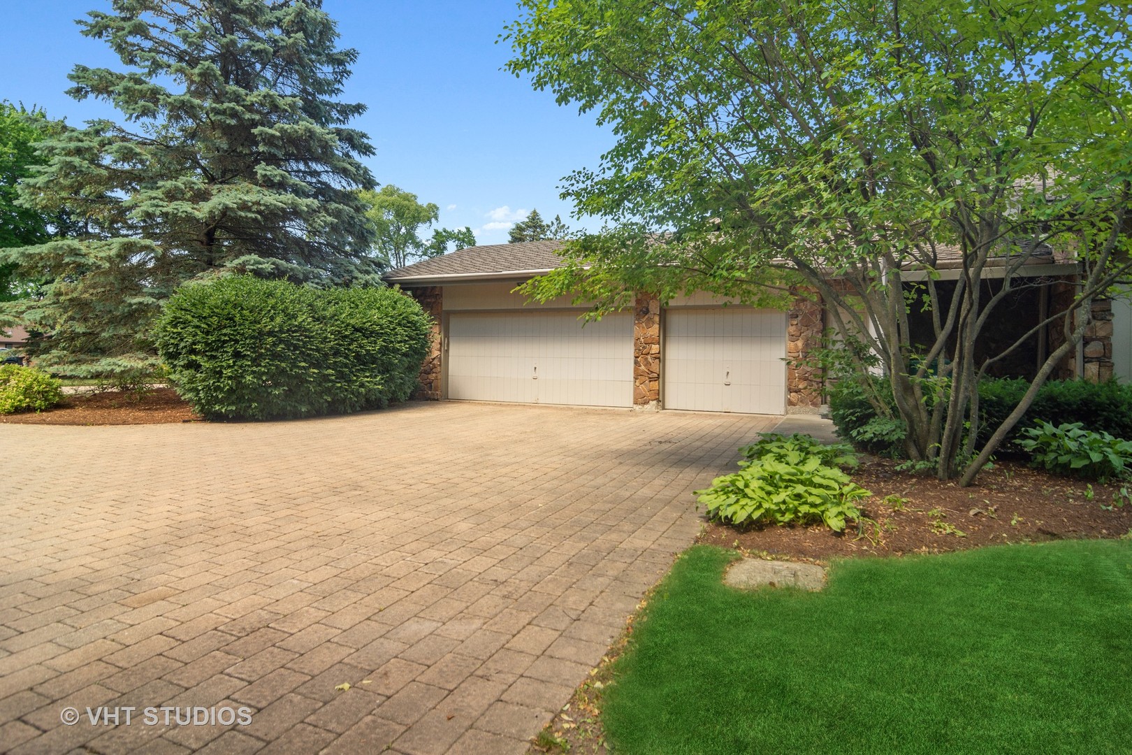 2327 Coach Road Long Grove, IL 60047 - Photo 5 of 58 a front view of a house with a yard and a garage