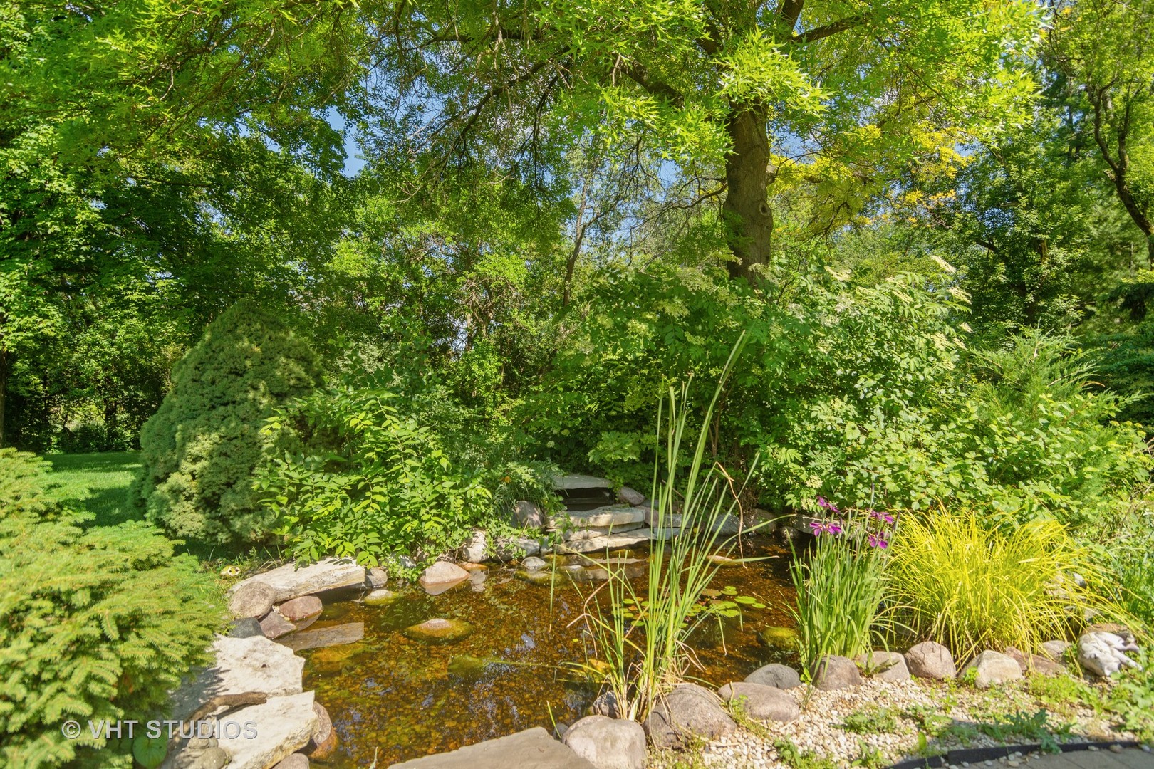 2327 Coach Road Long Grove, IL 60047 - Photo 46 of 58 a backyard of a house with lots of trees