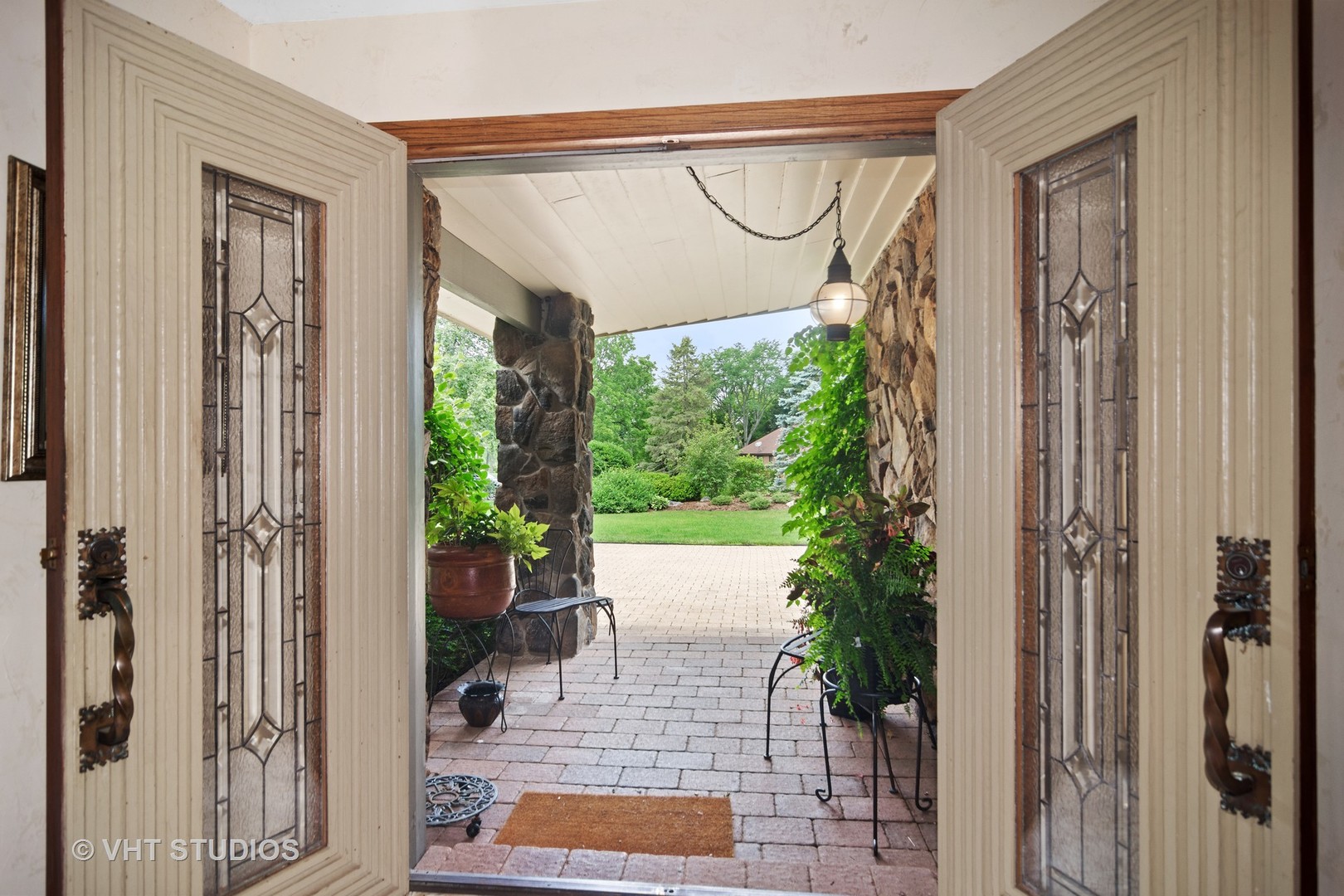 2327 Coach Road Long Grove, IL 60047 - Photo 6 of 58 a porch with furniture and potted plants