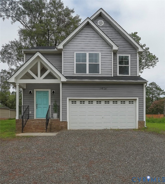 Two-story home with light gray horizontal siding a
