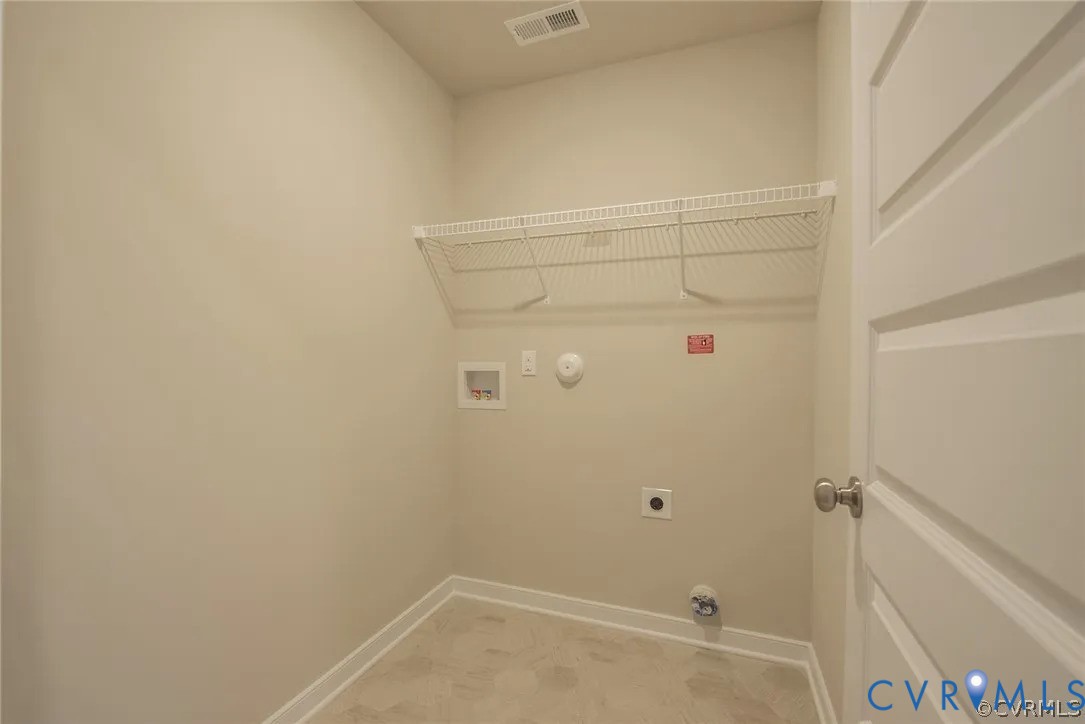 4820 Bethlehem Road Richmond, VA 23230 - Photo 12 of 13 Laundry area featuring wire shelving, wall hookups