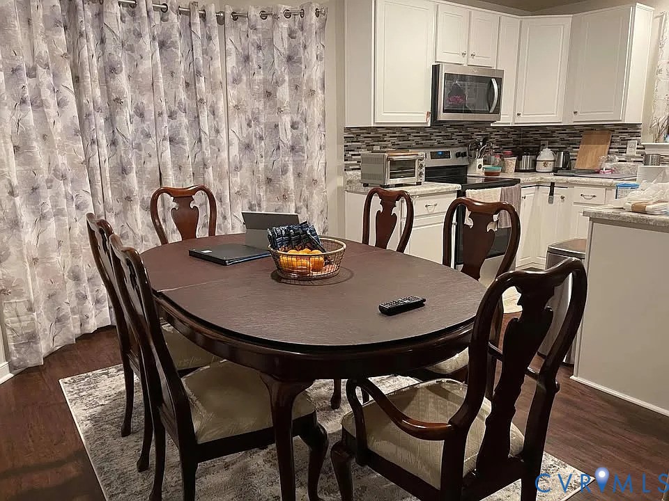 4820 Bethlehem Road Richmond, VA 23230 - Photo 4 of 13 Open-concept dining area featuring wood-finish flo