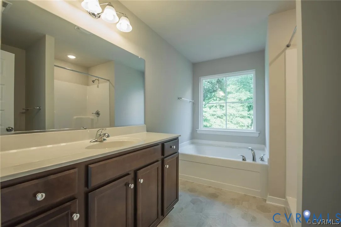 4820 Bethlehem Road Richmond, VA 23230 - Photo 8 of 13 Bathroom featuring a double vanity with dark wood