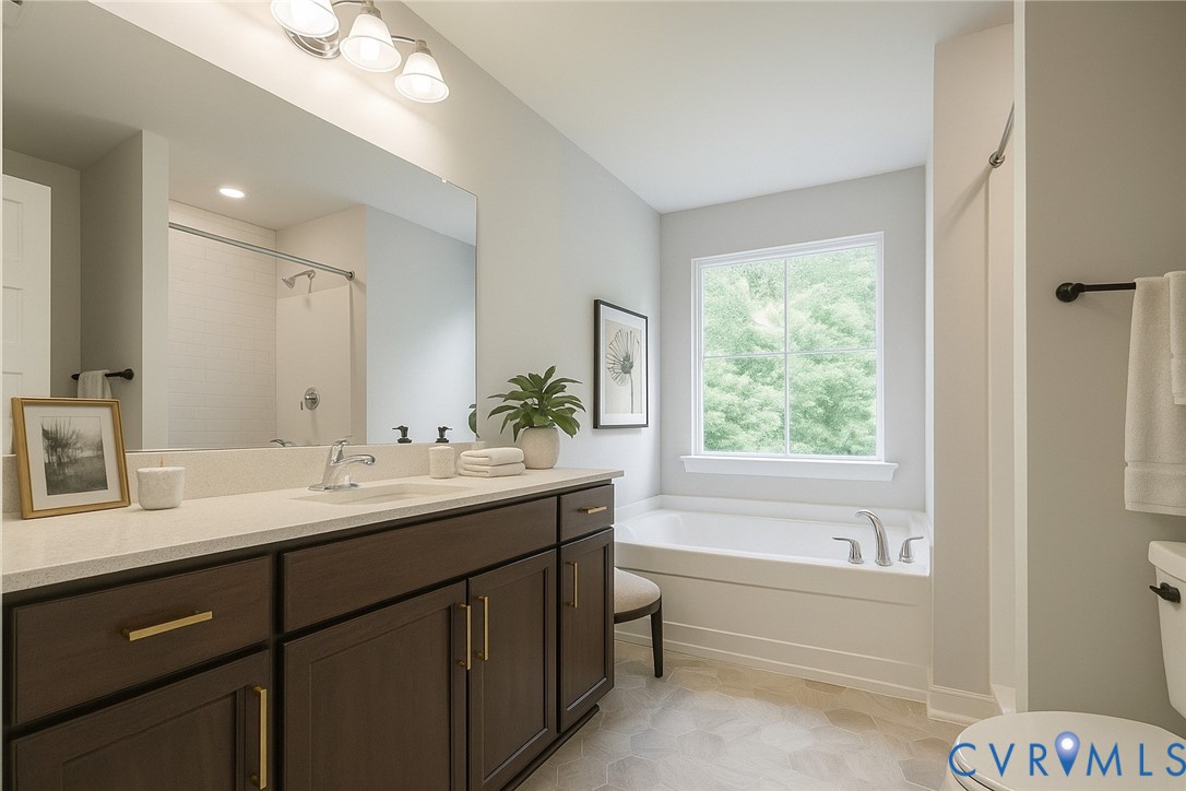 4820 Bethlehem Road Richmond, VA 23230 - Photo 9 of 13 Double vanity with dark wood cabinetry and gold-to