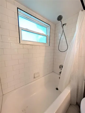 a bathroom with a toilet sink and a mirror